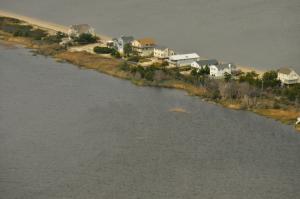 It's easy to see the precarious situation at Primehook Beach, a barrier island with little separation between the Delaware Bay and what used to be Prime Hook National Wildlife Refuge marshes. BY RON MACARTHUR