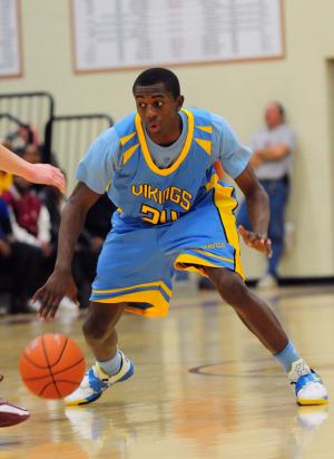 Cape senior Tony Hazzard puts a move on an opponent. Hazzard scored 14 points on the night. BY DAN COOK