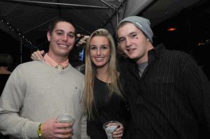 Lewes locals (l-r) Blake Woodruff, Shana Smith and Richard Dreasen socialize at one of the Rudder's many bars. BY STEVEN BILLUPS
