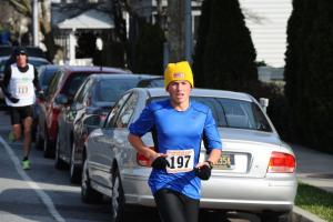 Austin MacElrevey won the Race into the New Year 5K for 2012, then jumped into ocean to begin 2013. BY DAVE FREDERICK