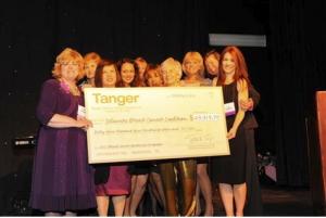 Delaware Breast Cancer Coalition Board members (l-r) Vicky Cooke, Nancy Blumberg, Dr. Kathrina Chua, Shalini Sawhney, Susan Chinnici, Okemah Strickland, Linda Powell, Patti Key, Dr. Clara Higgins, and Amy Norgate proudly hold a hefty $69,919. 70 check from Tanger Outlets at the 2012 gala. SOURCE SUBMITTED
