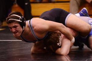 Cape's Hunter Daley, top, stretches Woodbridge 195- pounder Damian Smith to a 14-6 major decision. BY DAN COOK