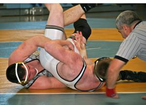 Cape's Thomas Ott tilts his opponent for back points on his way to a 10-2 victory in the 220-pound match against Sallies. BY PAT IRELAN