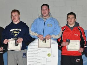 Cape's Thomas Ott stands atop the podium after winning his second straight state championship in the 220-pound weight class. Finishing second was Salesianum's Tommy Wilmoth, left, and third was Smyrna's Jordon Dailey. BY NICK ROTH