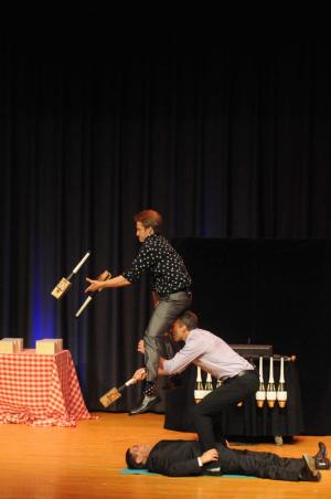 “The Passing Zone” were the performers for the event. The jugglers, Jon Wee, left, and Owen Morse, center, asked Gala Chair Rob Rider, laying down, to participate in their act. Juggling batons with large rattraps set to snap close, Wee leaps over Morse and Rider to catch the batons and continue juggling.