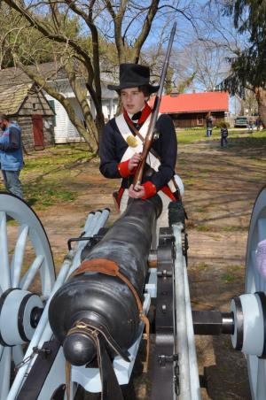 Re-enactor Chris Lieberman of Baltimore answers questions about a solider's life during the War of 1812. BY RON MACARTHUR