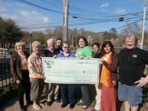 Representatives from the Milton Chamber of Commerce receive a check for $5,000 from the St. Patrick's Day parade committee and sponsors. Shown are (l-r) Georgia Dalzell, chamber executive director; Vicki Sammons, chamber vice president; Michael Clark, chamber president; John Potocki, chamber second vice president; Marie Mayor, Milton chamber board of directors; Maryellen Kiernan, parade committee; Jen Orlando, Irish Eyes; Charlene and Tom Jones, Irish Eyes. BY MOLLY MACMILLAN