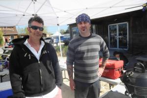 Cooking up burgers at the fundraiser are Sk8 project crew members “Rad” Chad Murr, left, and Brion Johnson. BY STEVEN BILLUPS