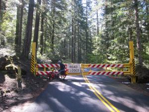 This is the snow gate on Route 242 headed eastward toward McKenzie Pass. Becky is offloading her panniers so we can lift her bike over the gate. It's a serious gate. They really don't want automobiles up there in the winter. It's a very scenic route and won't be opened until mid-June, except to walkers and cyclists.
