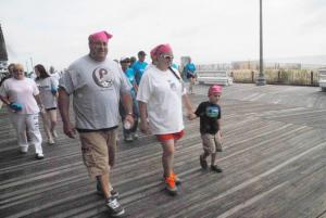 Shown walking the “Miracle Mile” are caregivers (l-r) Gino, Amy and Vincent DiBattista. BY STEVEN BILLUPS