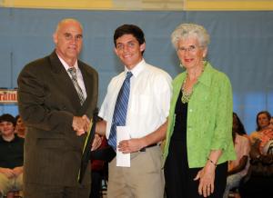 Trevor Aldred receives the Village Improvement Association Good Citizenship Award from Carolyn Billingsley and Cape principal Brian Donahue. BY DAN COOK