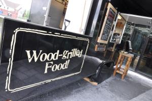Like the food at Dogfish's brewpub in Rehoboth Beach, the bratwurst at Bunyan's Lunchbox is cooked on a wood grill. BY NICK ROTH