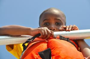 Darius Weldon keeps his eyes fixed on the water just in case a dolphin breaks the surface. BY RON MACARTHUR