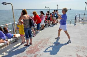Shields first-grade teacher Paula Hydro gets her sea legs just long enough to take a photograph. BY RON MACARTHUR