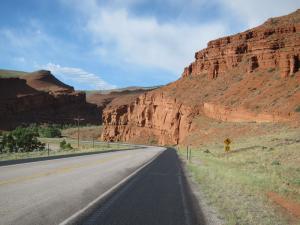 Before we climbed to the high Wyoming (wind-whipped) desert, we passed through dramatic red cliffs. We try to hit the road by 6:30 a.m. when winds and traffic are quiet.