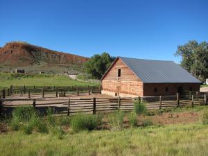 Several miles west of Lander we passed this ranch with the only building I've seen built with native rock this color.
