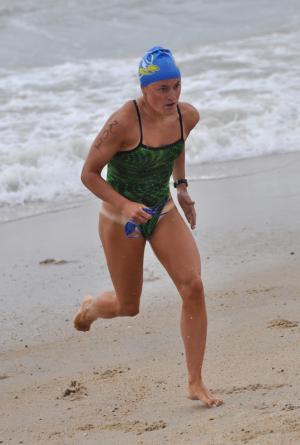 Joanna Baird, 20, of Lutherville Timonium, Md., was the first woman out of the water and the first to cross the finish line in 33:54. BY NICK ROTH
