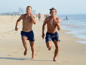 Ryan Nowakowski, left, and runner-up Rookie of the Year Ryan Sterrett sprint to the finish in the half-mile run. BY DAN COOK