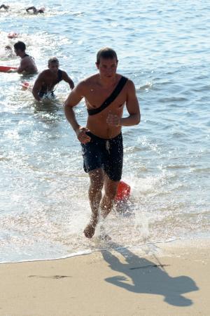 DBP Rookie of the Year Ben Woratyla sprints from the surf in the swim sprint competition. BY DAN COOK