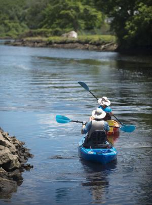 James and Lynette Vaught of Arizona head out on the Broadkill River to escape the heat. BY DENY HOWETH