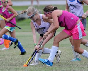Anna Erskine, left, of Friends School in Wilmington battles for the ball with Lauren Tyre of MOT Charter School. BY DAN COOK