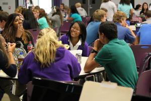 The new building provides space for all 177 DCHS students to eat lunch together, much to the delight of juniors Nadia Gulab of Millsboro, left, Elisha Beckett of Laurel and their lunch table companions. SOURCE SUBMITTED