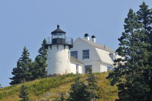 Bear Island Lighthouse sits atop a hill near North East Harbor, Maine. The present structure was built in 1889; the light was deactivated in 1981 and turned over to the Friends of Acadia National Park in 1989. It is privately leased. BY RON MACARTHUR