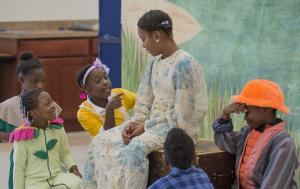 Peter Pan, played by Jamiah Eley, Journey White as Michael; Alaria Lewis as Tootles, Niyah Wyatt as Mother, Ernest Lofland as Nibs and Jeremiah Bruce as John all settle in for a story after their journey to Neverland. BY DENY HOWETH