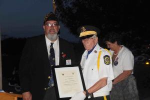 Post 28 Commander Chuck Nimmerichter presents Hugh Thornton with a certificate of commendation in honor of his dog Sam, a hero from the World Trade Center on 9/11. Thornton was a building inspector for the City of New York and was at the site of the fallen Trade Center buildings. A collapse trapped Thornton and a search dog, Sam, found Thornton and stayed by his side until Thornton was extracted. After the event Thornton visited Sam at the firehouse to give his thanks. Sam had reached retirement and the firefighters wanted to give Sam to Thornton. Sam passed this last year. Thornton said, “Sam got the good sendoff, the way he should have gotten.” BY STEVEN BILLUPS