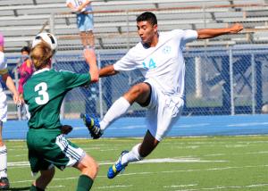 Cape senior forward Miguel Merino-Sanchez gets the ball past Tower Hill's Bradley Pedano. BY DAN COOK
