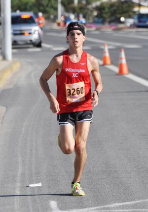 Sixteen-year-old Stephen Garrett, a junior at Tatnall School, cruises toward the finish line to win the Bottle & Cork 10-Miler in 54:18, a 5:26 per mile pace. BY NICK ROTH