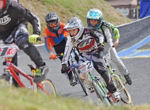 David Albert of Westfield, Mass., looks to make up some ground in the 12 expert division in front of Nathan Sykes of Hanover, Md., left, and Joseph Hall of Chester, Va. BY NICK ROTH