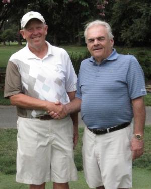 Kings Creek Country Club's season-long match play champion Dennis Durkin, left, shakes the hand of runner-up Bill Kennedy. SOURCE SUBMITTED