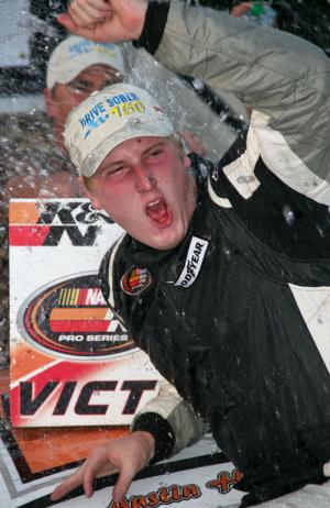 Austin Hill celebrates winning the K&N Series race at Dover Friday afternoon in the Gatorade victory lane. BY PAT IRELAN