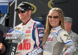 Dale Earnhardt Jr. receives the Coors Light Pole award. Earnhardt finished second to teammate Jimmie Johnson in Sunday's 400-mile race. BY PAT IRELAN