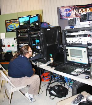 NASA TV occupies a corner of the visitor's center with their video and broadcast equipment. Here is the last stop before the video is available to the public. BY TERESA RODRIGUEZ
