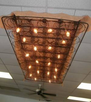 Byerly's husband, Richard, built this light fixture out of a box-spring mattress. BY MOLLY MACMILLAN