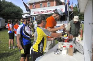 Hungry cyclists pour ketchup on their scrapple sandwiches at Uncle Ted's Place near Milton. The stop has been a favorite of cyclists for more than 25 years. BY RON MACARTHUR