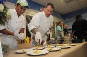 Putting the finishing touches on some huevos rancheros is Baywood Greens Executive Chef Mike Clampitt, right, with his assistant Antonio Cruz. BY STEVEN BILLUPS
