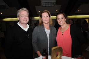Enjoying the pre-auction festivities are (l-r) Brian Ellis and Cindy Szabo of Ellis Szabo Attorneys-at-Law, and Kathy Newcomb of Coldwell Banker. BY STEVEN BILLUPS