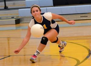 Cape senior libero Kristin Perkinson dives for a dig during the final game with the Riders. BY DAN COOK