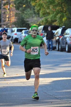 As quick as the Green Lantern, Dan MacElrevey of Lewes wins the male masters division, crossing the finish line in 17:56 in second place overall. He finishes just ahead of Todd Buchanna.