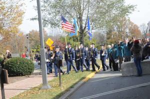 At the beginning of the ceremony, the Dover Air Force Honor Guard posts the colors as veterans and members of the Delaware Commission of Veterans Affairs salute. BY STEVEN BILLUPS