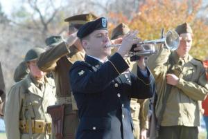 Specialist Brian Ruby of the Delaware National Guard Band plays "Taps" at the closing of the ceremony. BY STEVEN BILLUPS