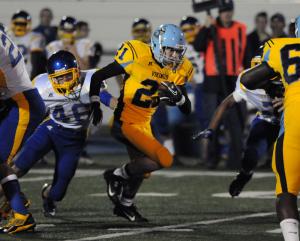 Cape senior Thomas Mesisco runs back the opening kickoff for good starting position for the Vikings. BY DAN COOK