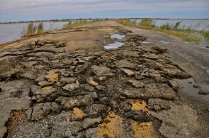 Without the protection of the marsh, Prime Hook Road has become a target for storm damage. This is what the road looked like following an August 2011 storm. SOURCE SUBMITTED