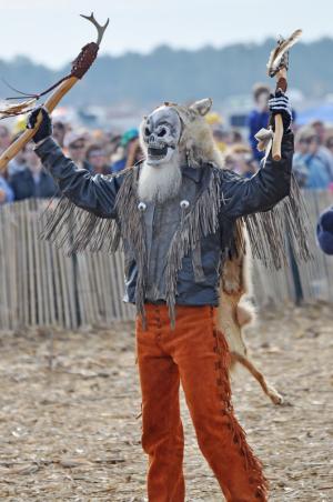 Will Bennett of Dover, Pa., gets the crowd going as the human-powered division takes its turn in the second day of Punkin Chunkin. BY NICK ROTH