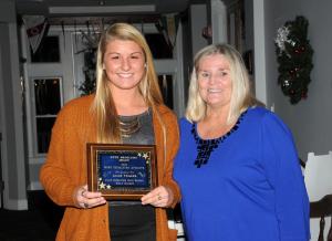 Ruth Skoglund, right, presents the Ruth Skoglund Most Dedicated Athlete Award to Allie Yeager. BY DAN COOK