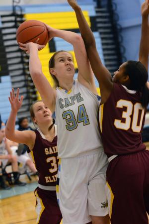 Cape freshman forward Abigail E'Nama goes strong to the hoop on St. Elizabeth's Alanna Speaks. BY DAN COOK