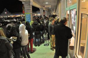 A long line of shoppers waits Thanksgiving night for the opening of the Sony outlet store. BY RON MACARTHUR